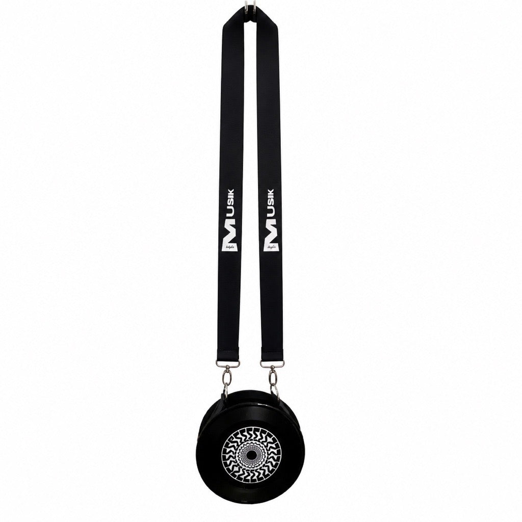 A black circular crossbody bag with a matching black shoulder strap featuring white 'MUJIK' branding, shown against a plain white background.