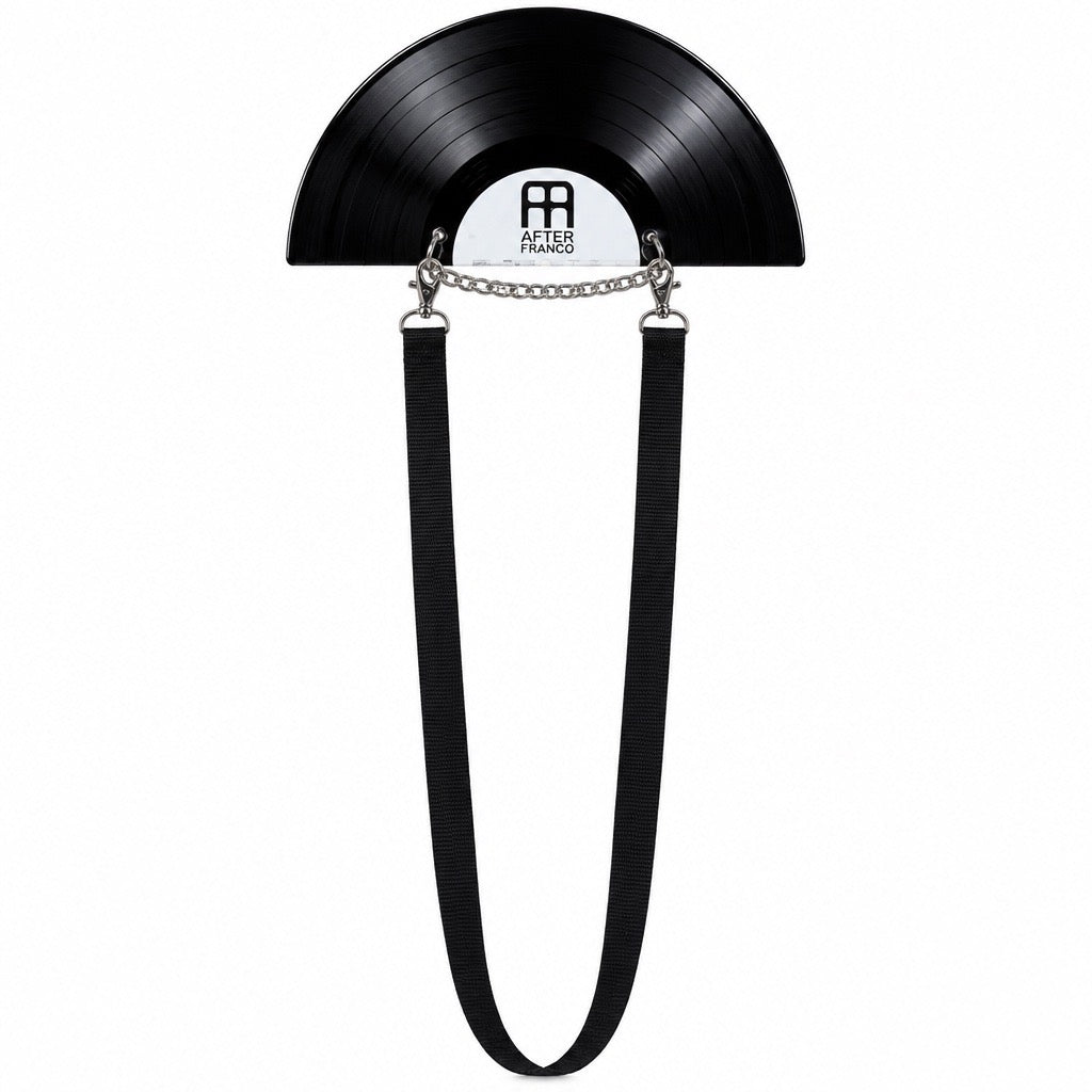 A black vinyl record wall clock by After 8, featuring a black hanging strap and a silver chain detail, shown against a plain white background. After Franco
