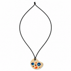 A black cord necklace featuring a wooden paint palette pendant with colorful painted dots in blue, orange, and red on a white background. Silvia Tolomei best handmade jewelry in Tuscany. Tuscany jewelry. Tuscan jewelry. Populonia best store to visit. Things to do in populonia. 