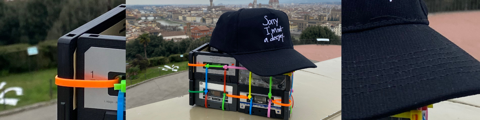 Black cap with text on a cityscape background. Sorry I'm Not A Deejay