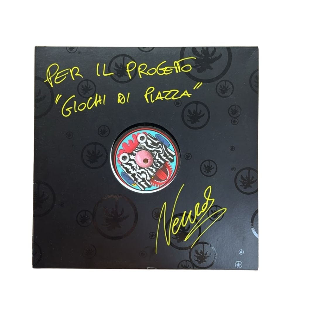 A square black collectible display plaque or box featuring the text 'PER IL PROGETTO "GLOCI DI PIAZZA"' in yellow, a circular colorful central emblem, black cannabis leaf motifs, and a yellow signature reading 'Nees' on a white background. FABIO NEURAL & DJ FRONTER – DING DONG EP