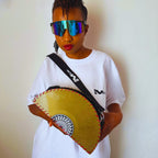 Yellow circular saw blade bag with black strap on a white background. francesca farfa musek label sorry im not a deejay vinyl purse. Sharri Sharing